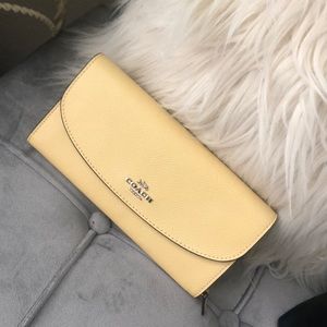 Pale yellow coach wallet